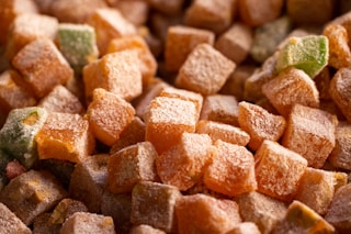 a close up of a pile of sugar cubes