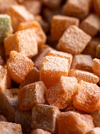 a close up of a pile of sugar cubes
