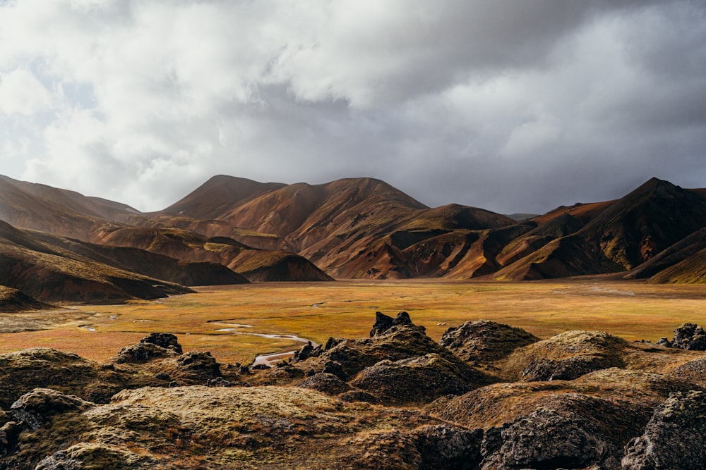 a mountain range with a valley in the foreground