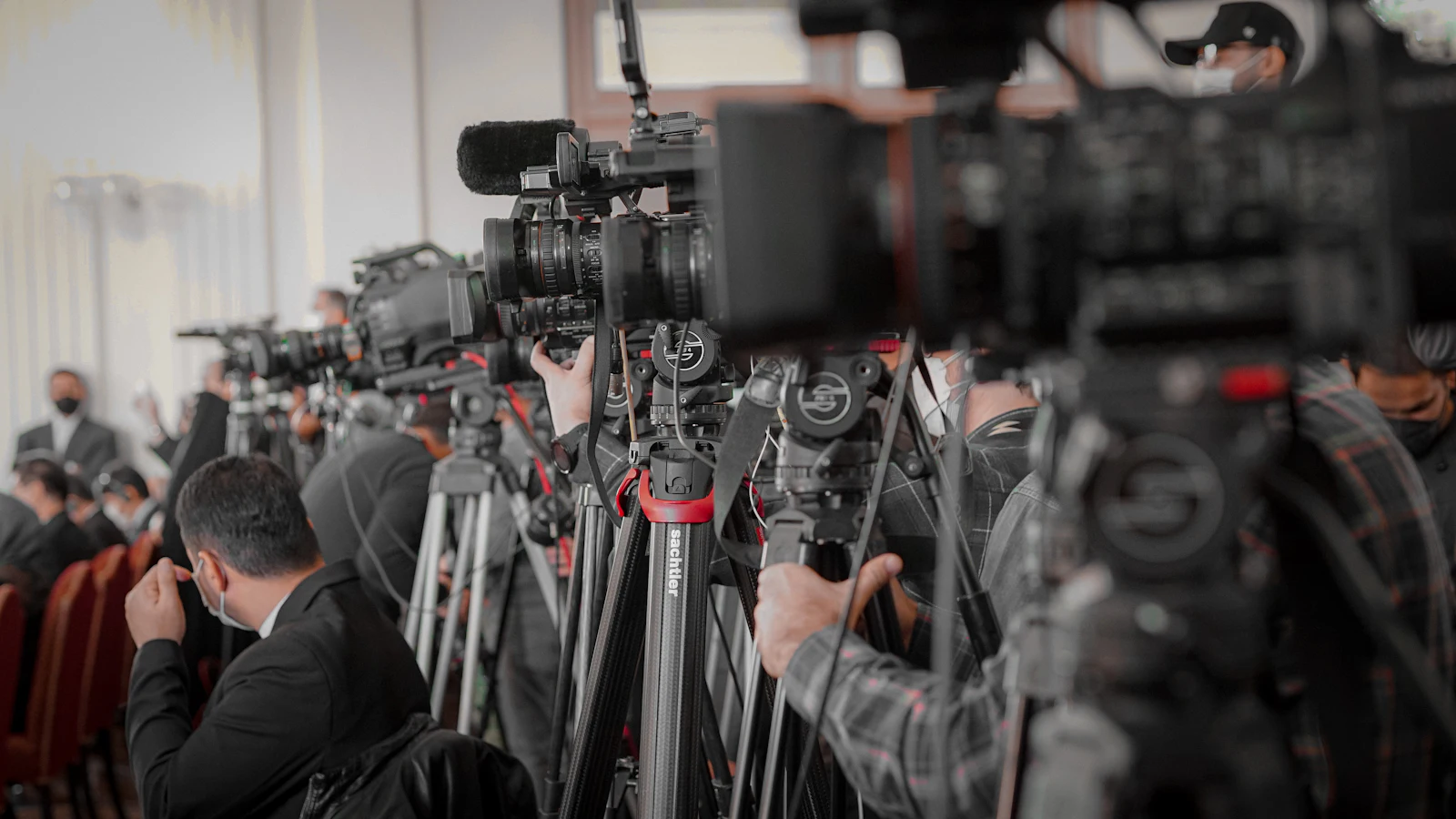 Journalists and photographers with cameras at a press event, the kind of coverage a PR agency in India sets up