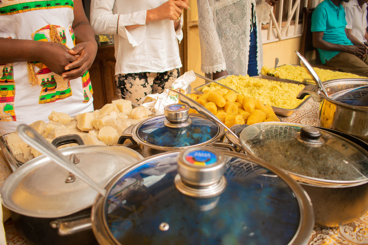 People gathered around a table of food in Lagos