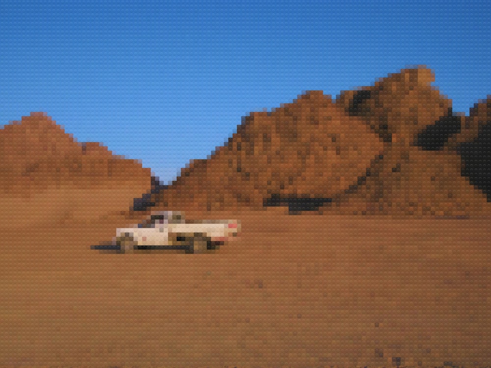 a truck is parked in the middle of a desert