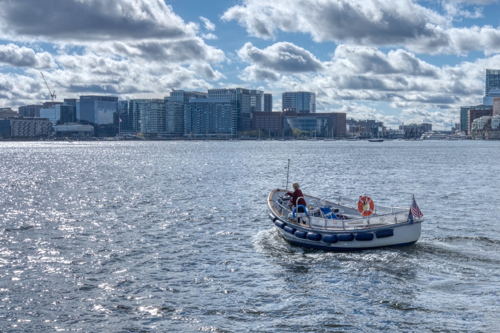 a small boat in the middle of a large body of water