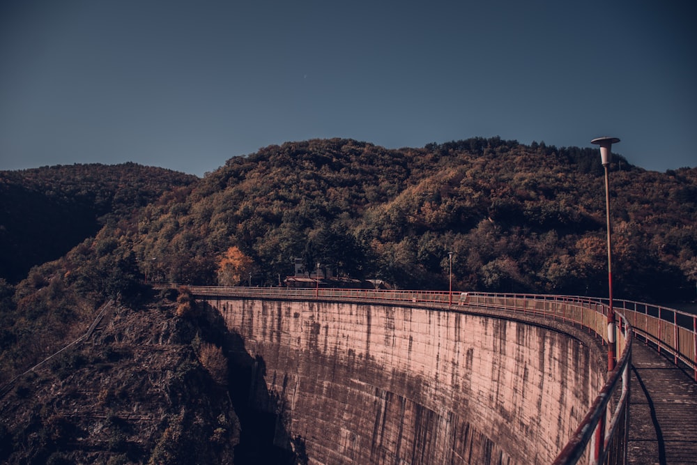 a large dam on the side of a mountain