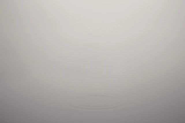 A warm gray textured background symbolizing calm and connection