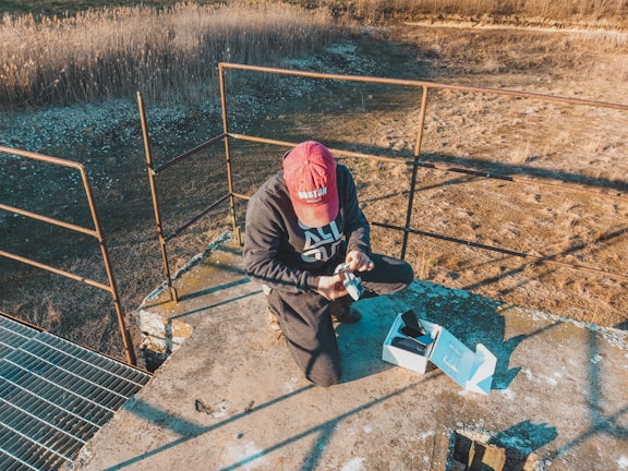 A customer assembling a drone using parts from the store.