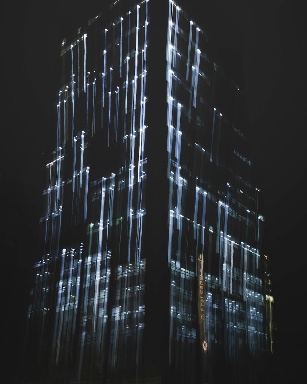 a very tall building lit up at night