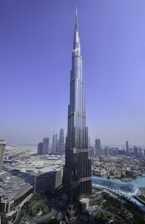 a very tall building towering over a city