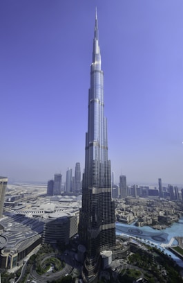 a very tall building towering over a city