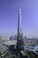 a very tall building towering over a city