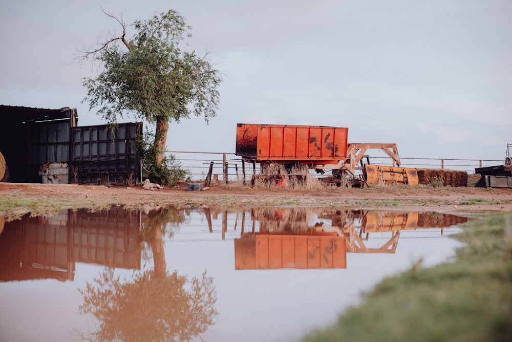 a truck parked next to a body of water