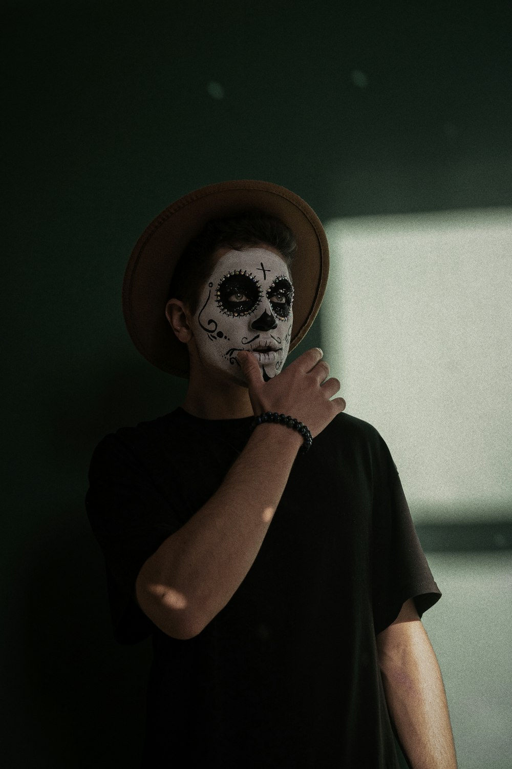 a man with a skeleton face painted on his face