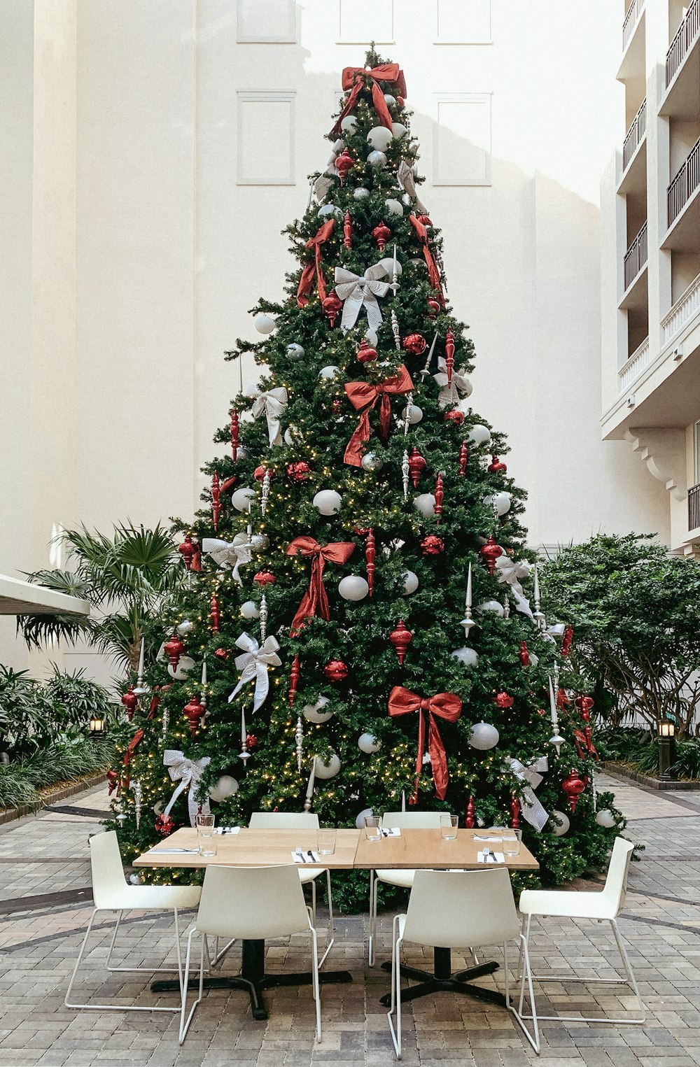 a decorated christmas tree in a hotel lobby