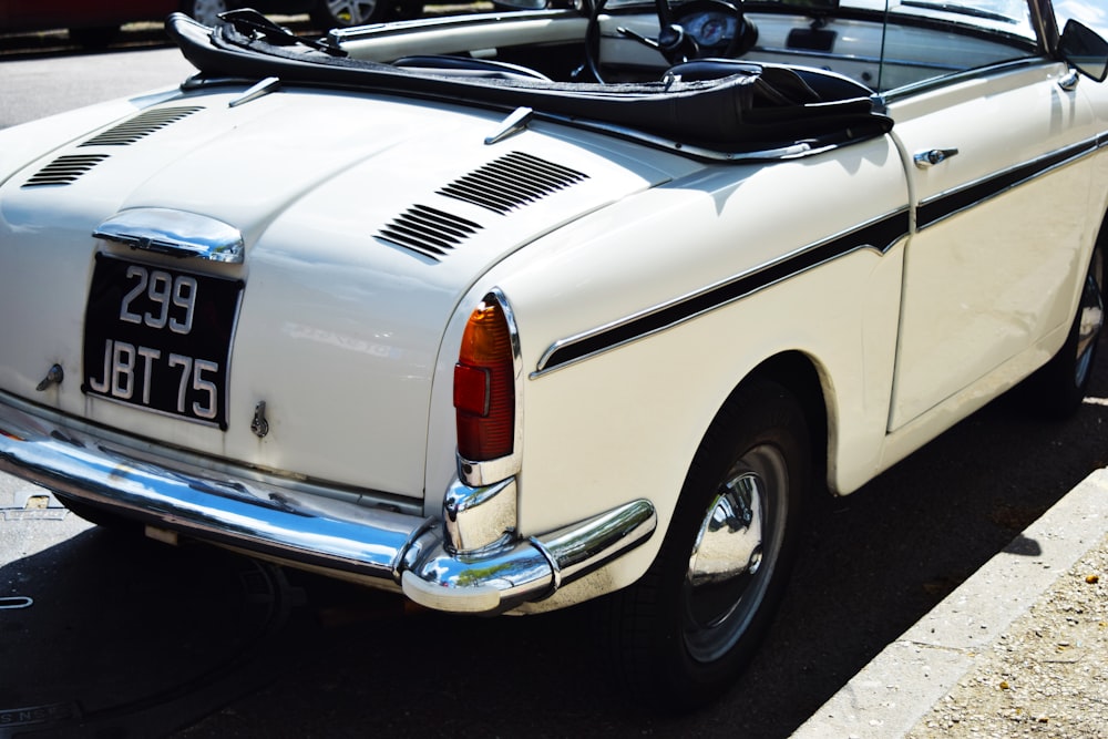 a white car parked on the side of the road