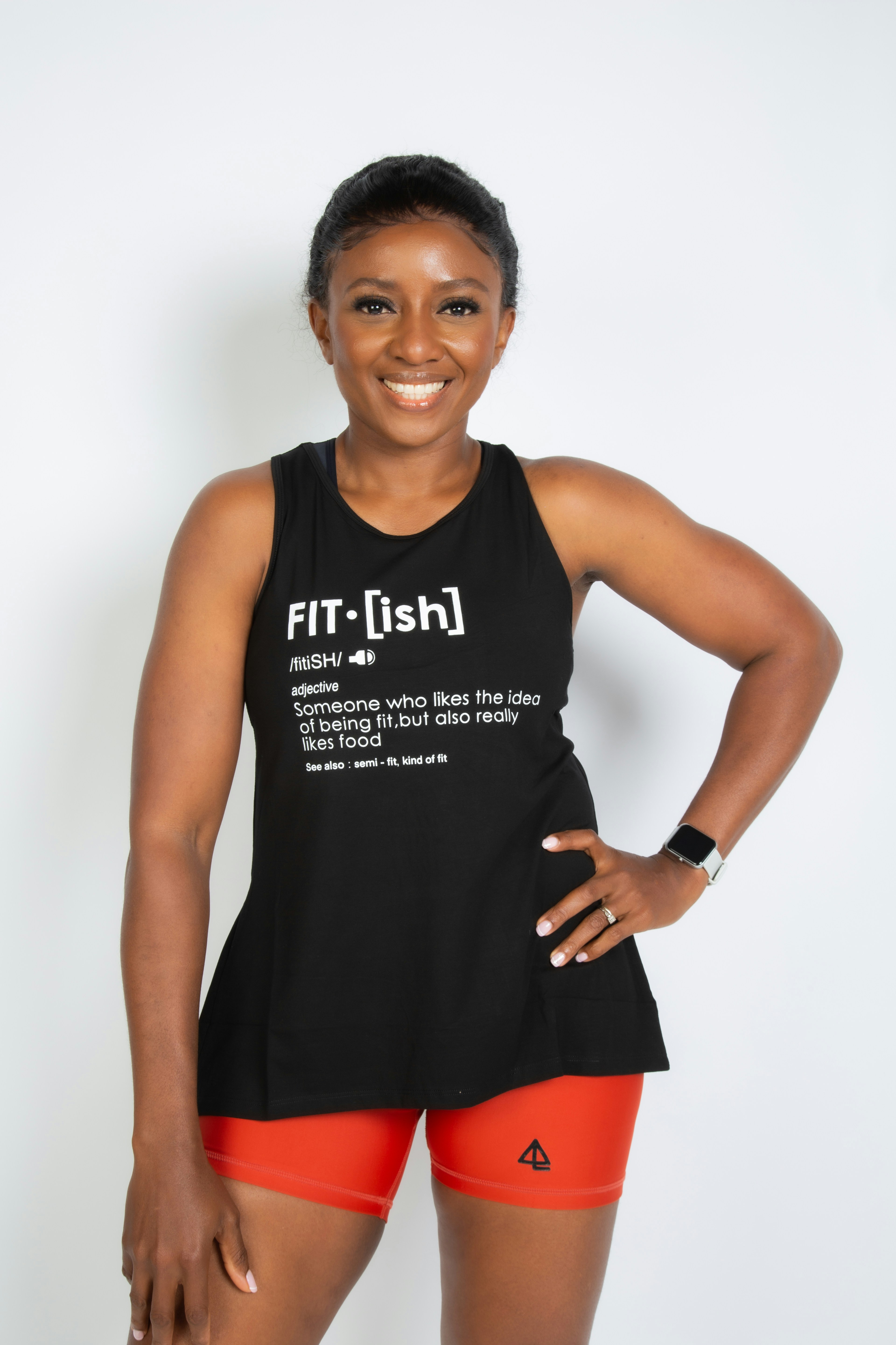 a woman posing for a picture in a black tank top