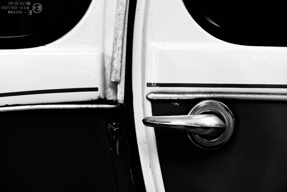 a black and white photo of a door handle
