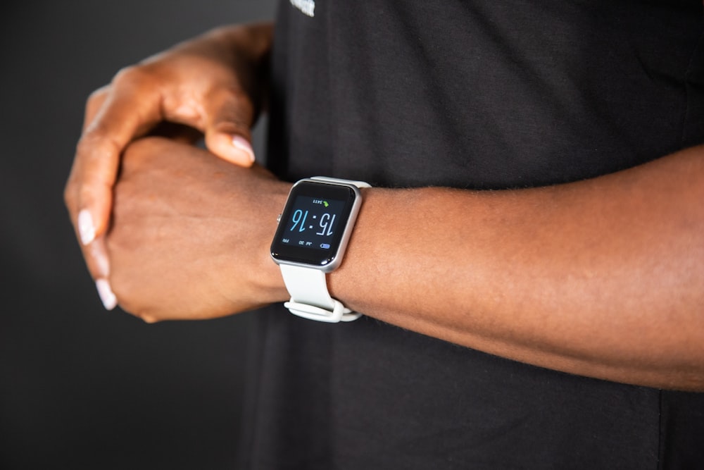 a close up of a person wearing a watch