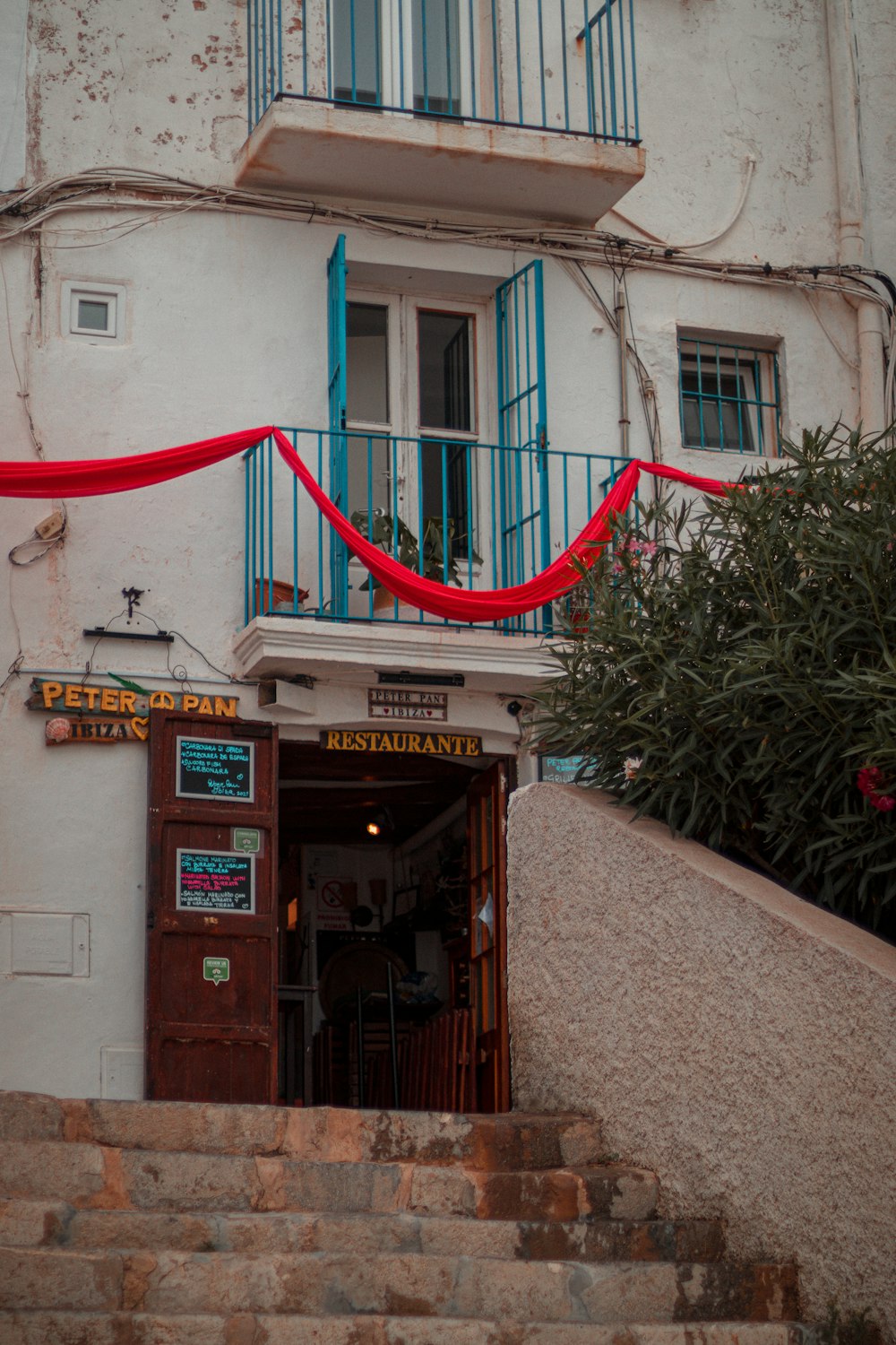 a building with a red ribbon on the top of it