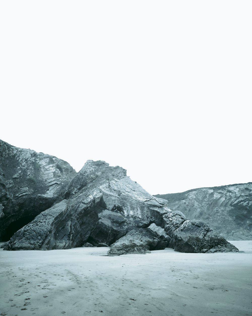 a black and white photo of a mountain range