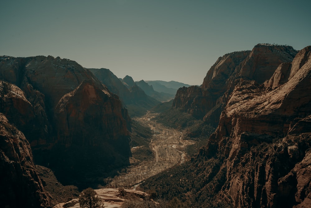 a view of a valley with mountains in the background