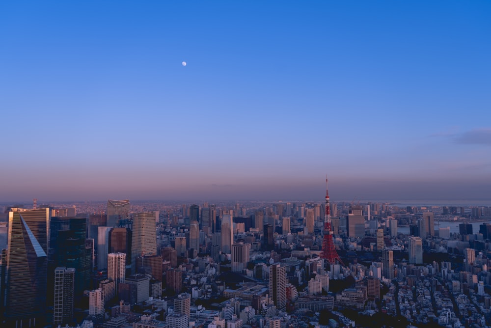 an aerial view of a city at dusk