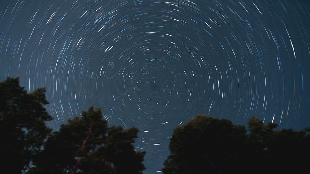 a star trail is seen in the night sky