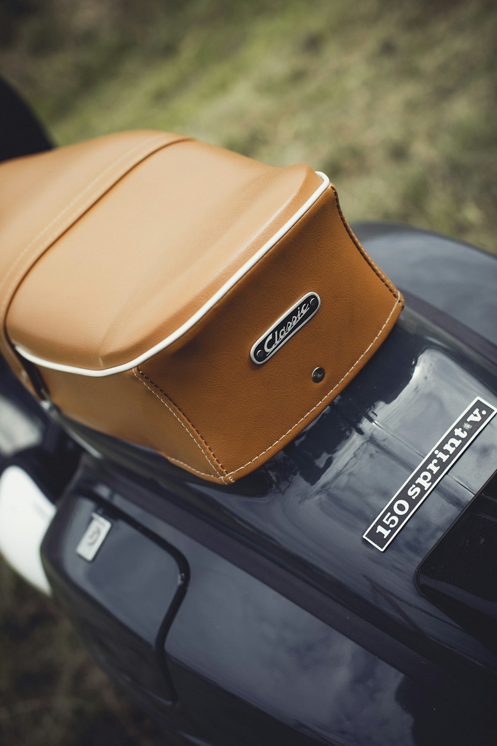 a brown leather seat on a black motorcycle