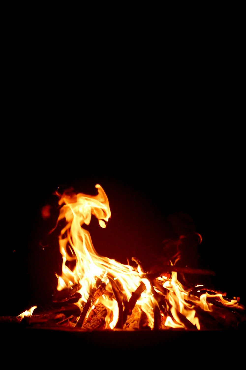 a fire burning in the dark with lots of flames