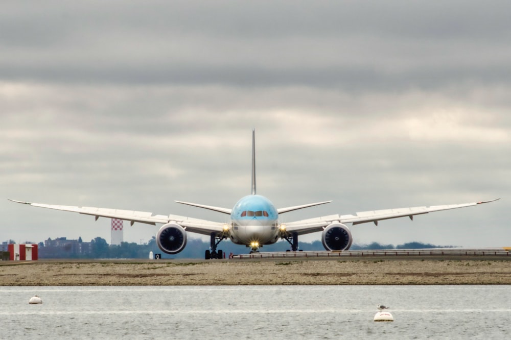 a large jetliner sitting on top of an airport runway