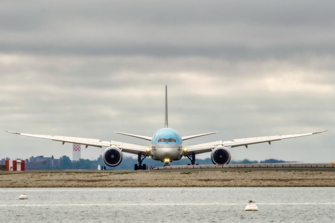 a large jetliner sitting on top of an airport runway, Korean Airliens
