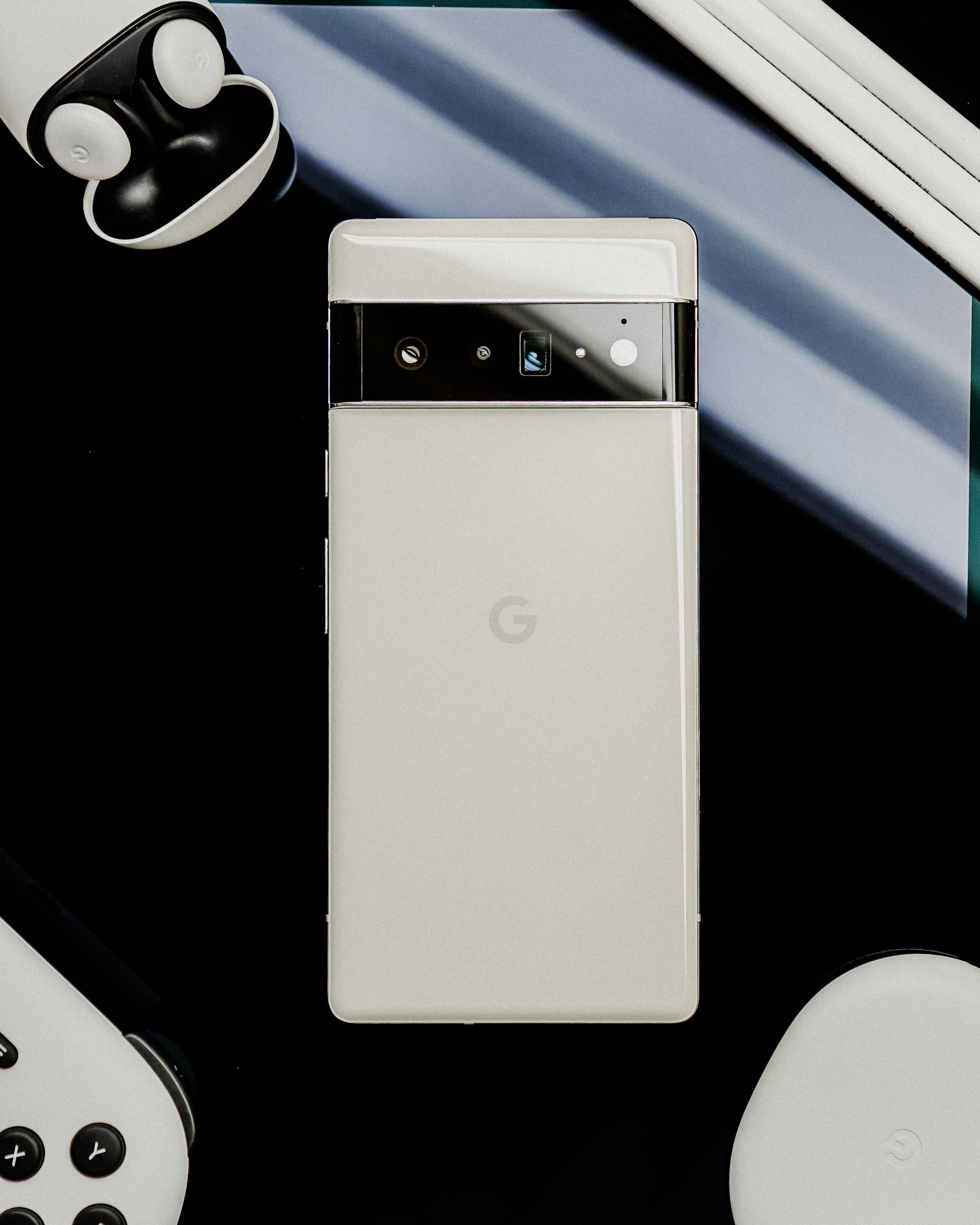a white cell phone sitting on top of a table