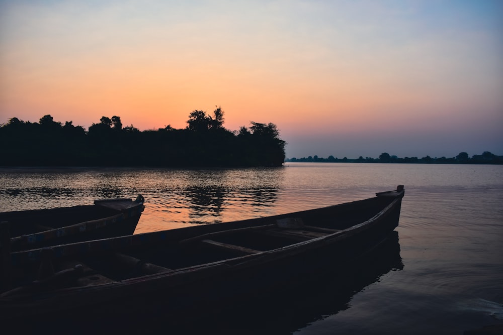 a couple of boats that are sitting in the water