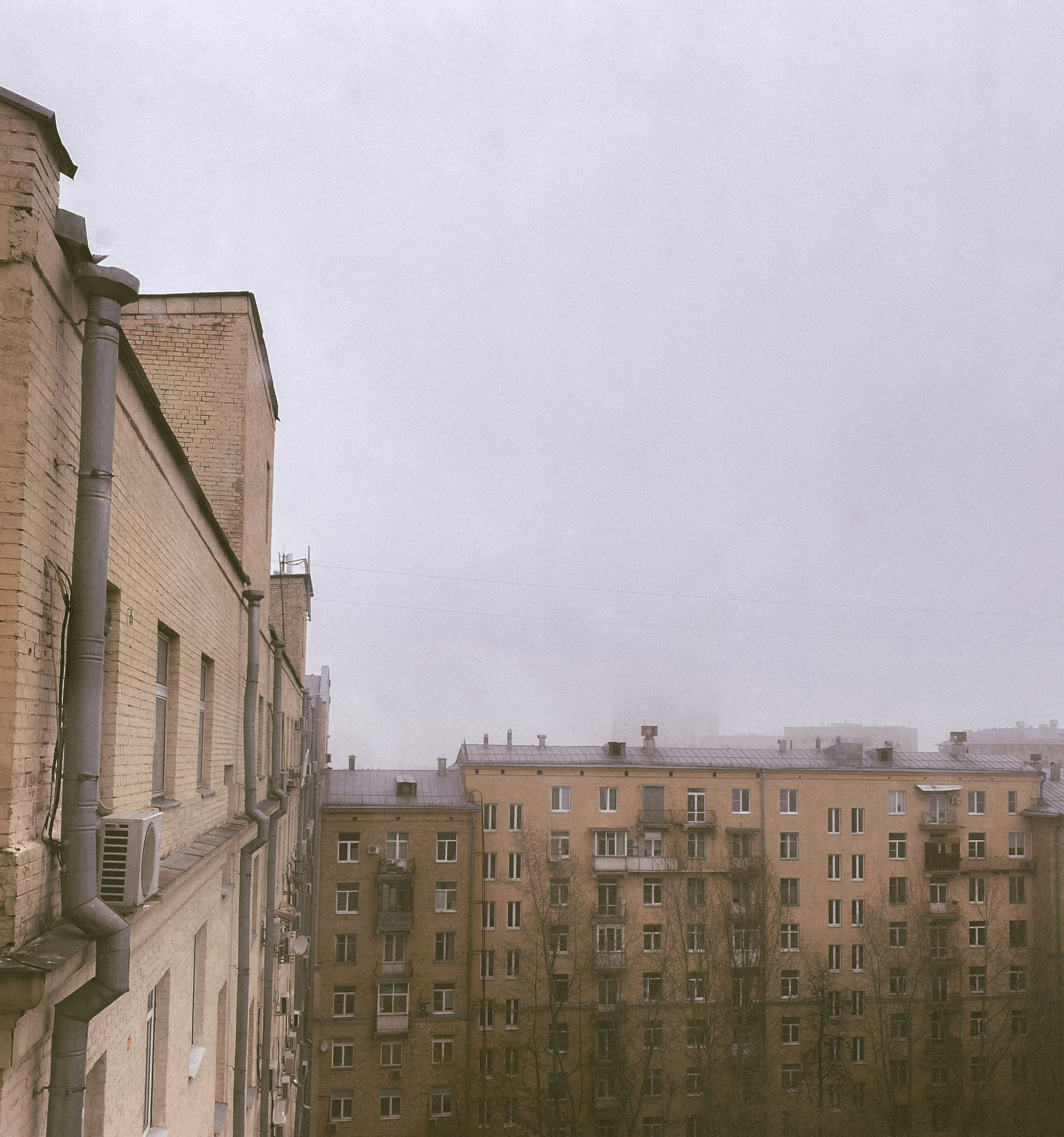a very tall building with a clock on it's side