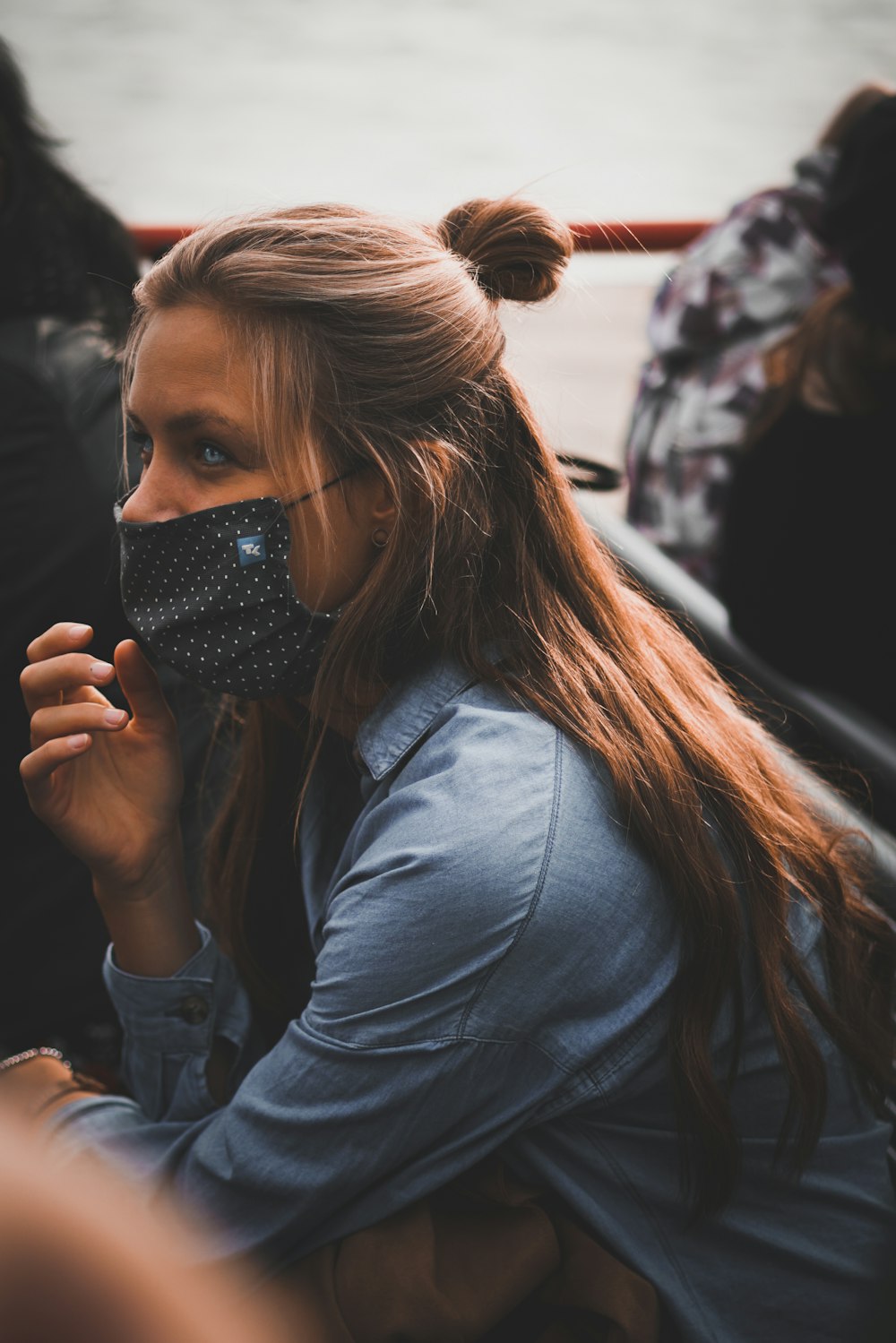 a woman with a mask covering her face