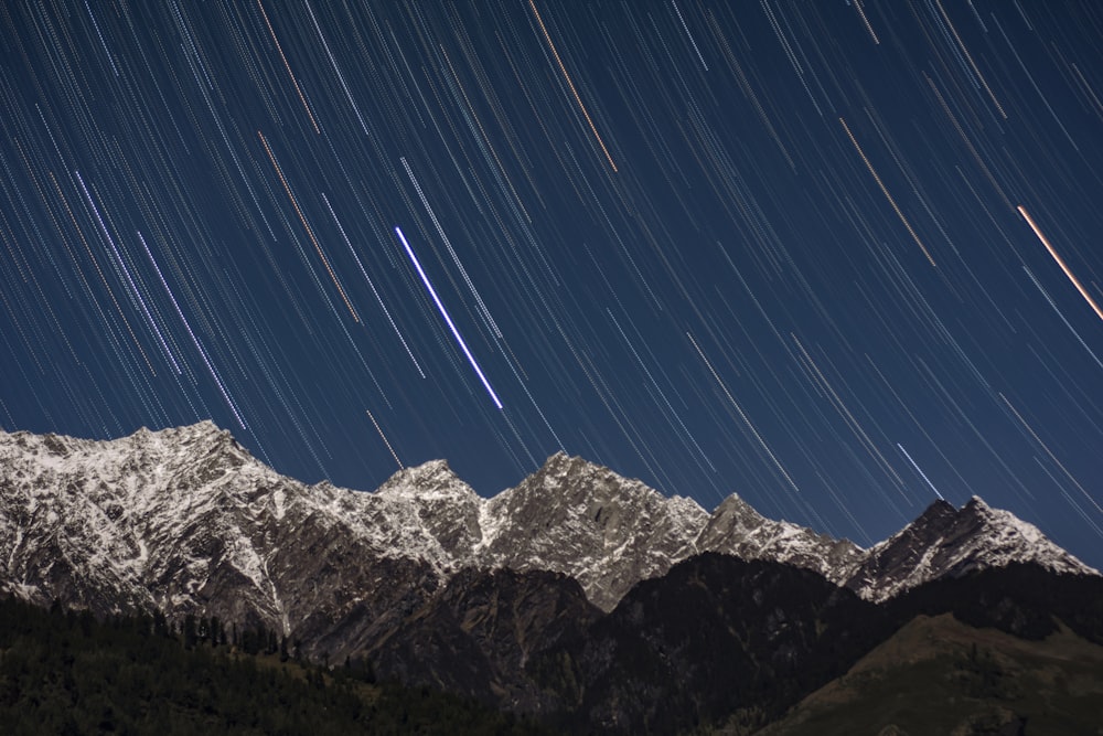 a mountain range with stars in the sky