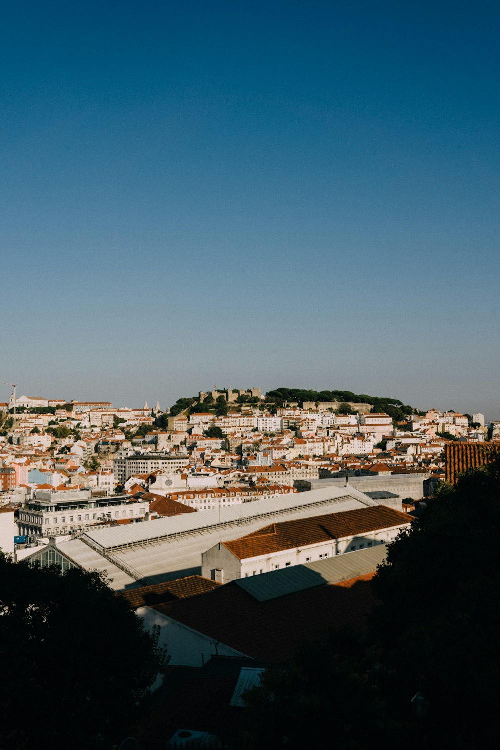 a view of a city from the top of a hill