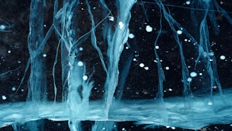 a picture of some ice and water in the dark