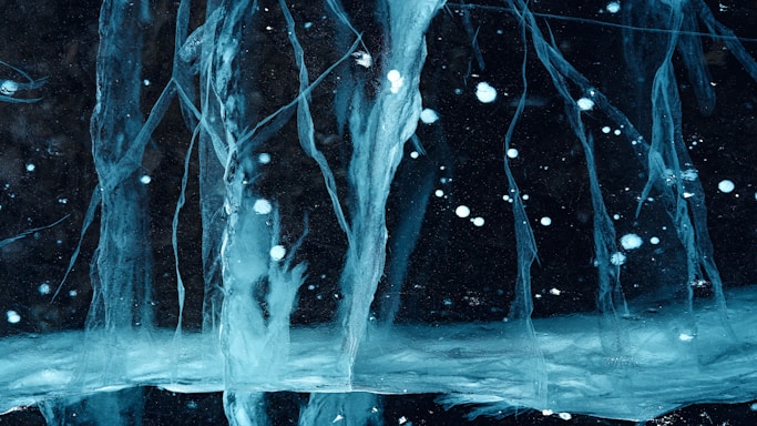 a picture of some ice and water in the dark