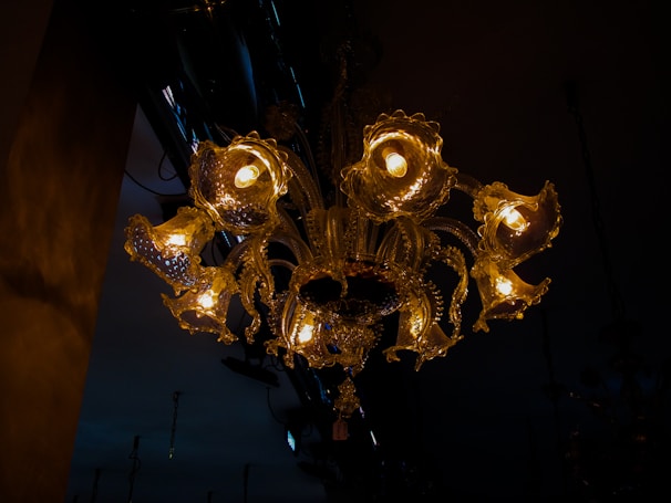 An elegant chandelier casting warm light in a beautifully decorated room.
