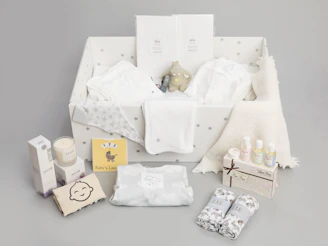 a baby's gift hamper with its contents laid out
