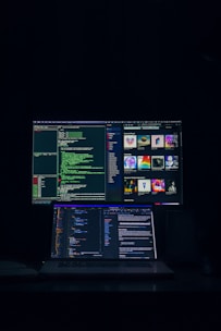 a laptop computer sitting on top of a desk