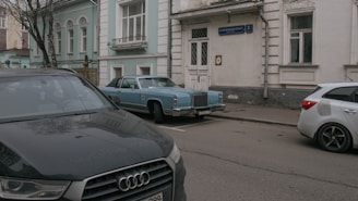 two cars parked on the side of the road