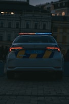 a police car parked in front of a building