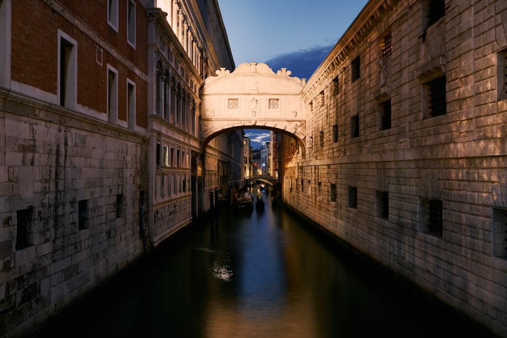 a narrow canal running between two buildings in a city