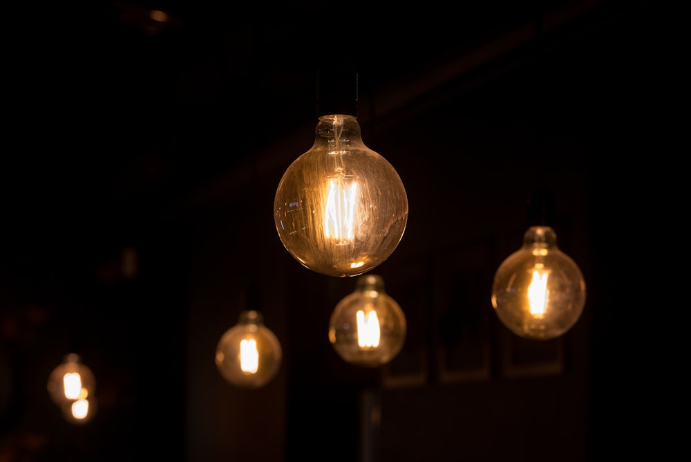 a group of light bulbs hanging from a ceiling