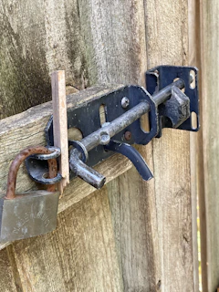 Electric bolt lock mounted on a sturdy metal gate, demonstrating robust security features.