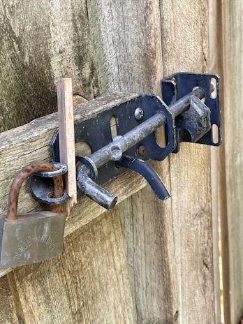 Electric bolt lock mounted on a sturdy metal gate, demonstrating robust security features.