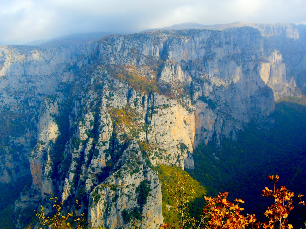 a view of a mountain with a cliff in the background