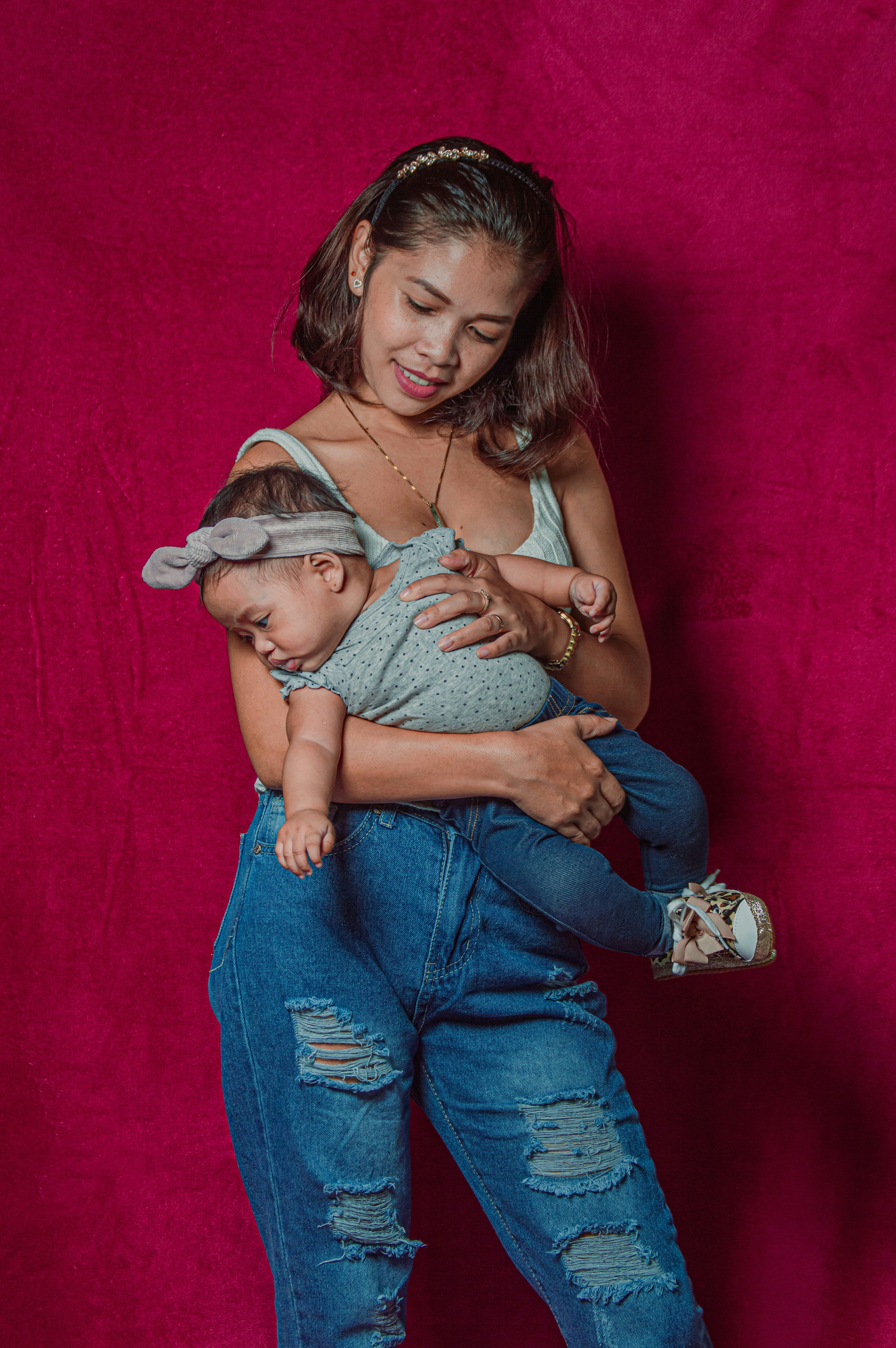 a woman holding a baby in her arms