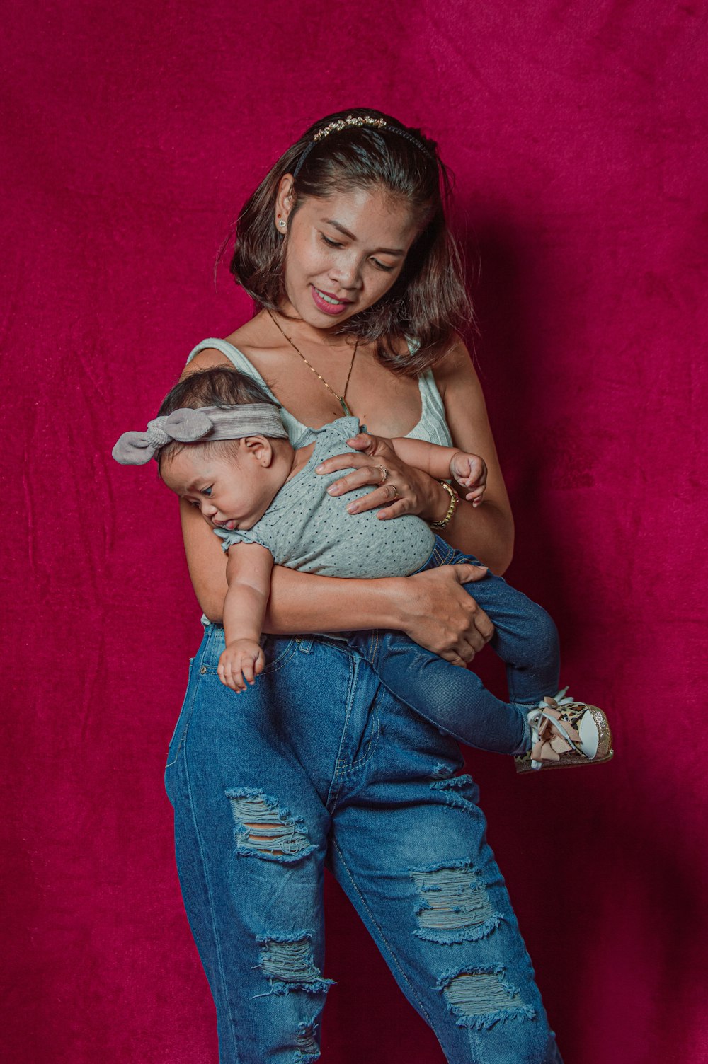 a woman holding a baby in her arms